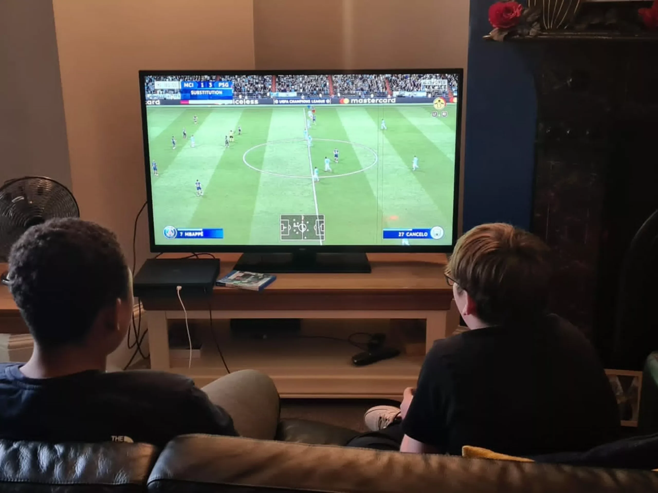 Young people playing on a games console in Warwick House