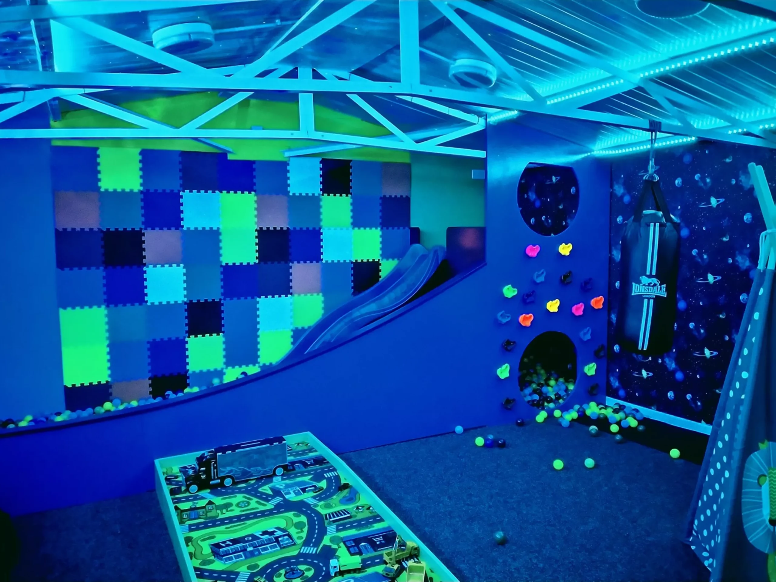 Slide under UV lights in Woodend House games room