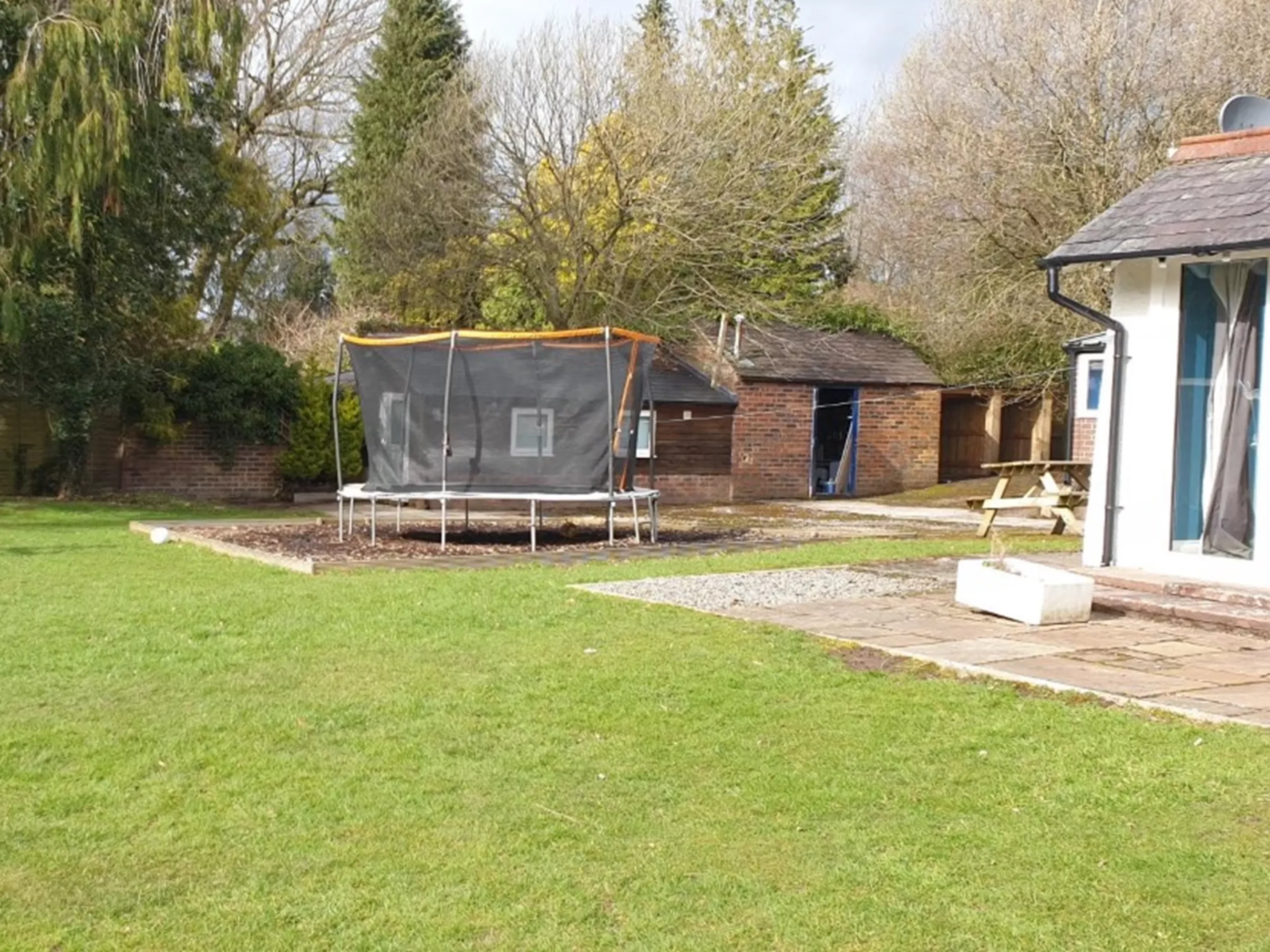 Trampoline in the Woodend House garden