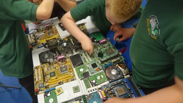 Students working with microchips at Kirby Moor School