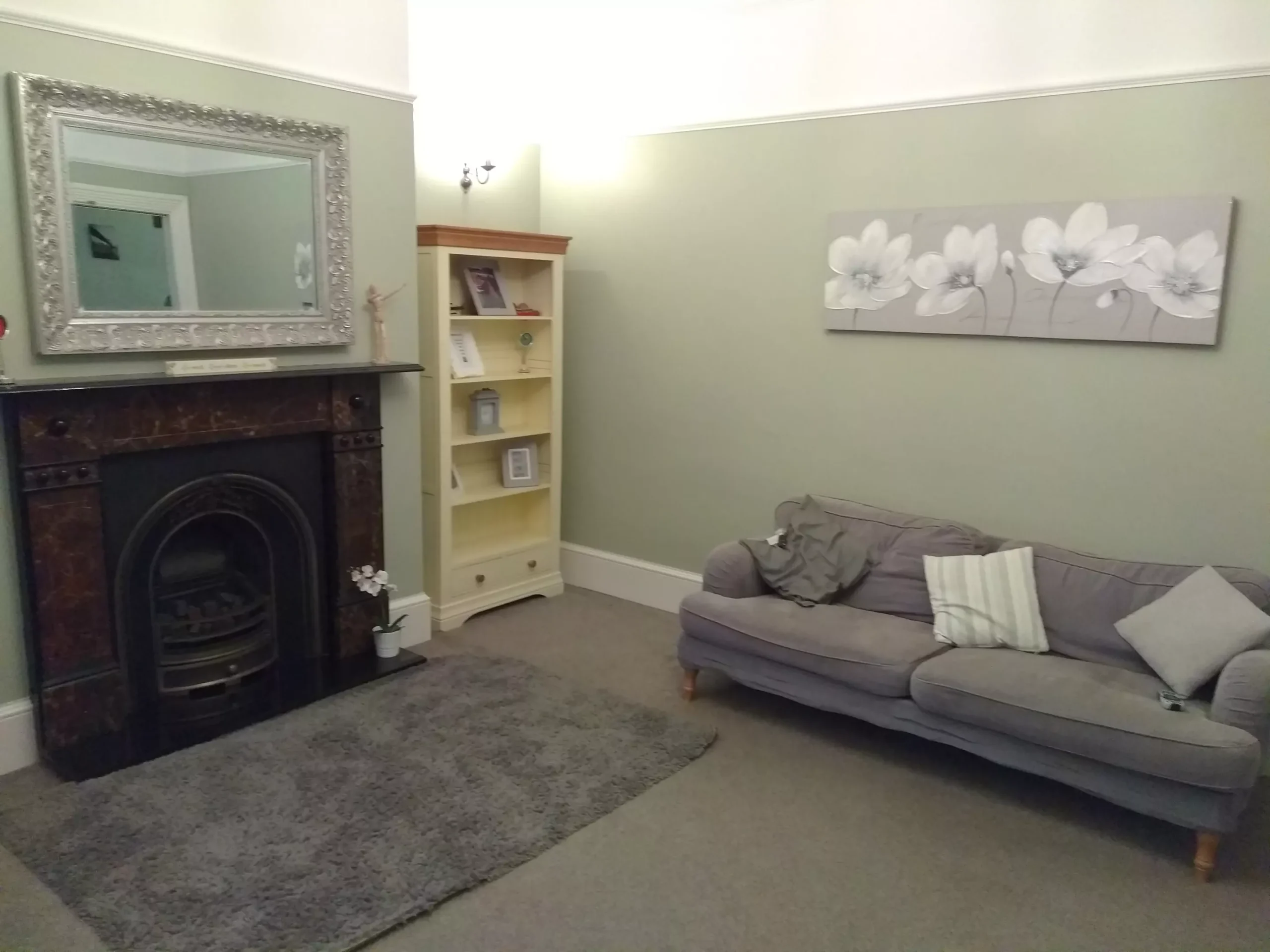 Fireplace and bookcase in the Warwick House living room