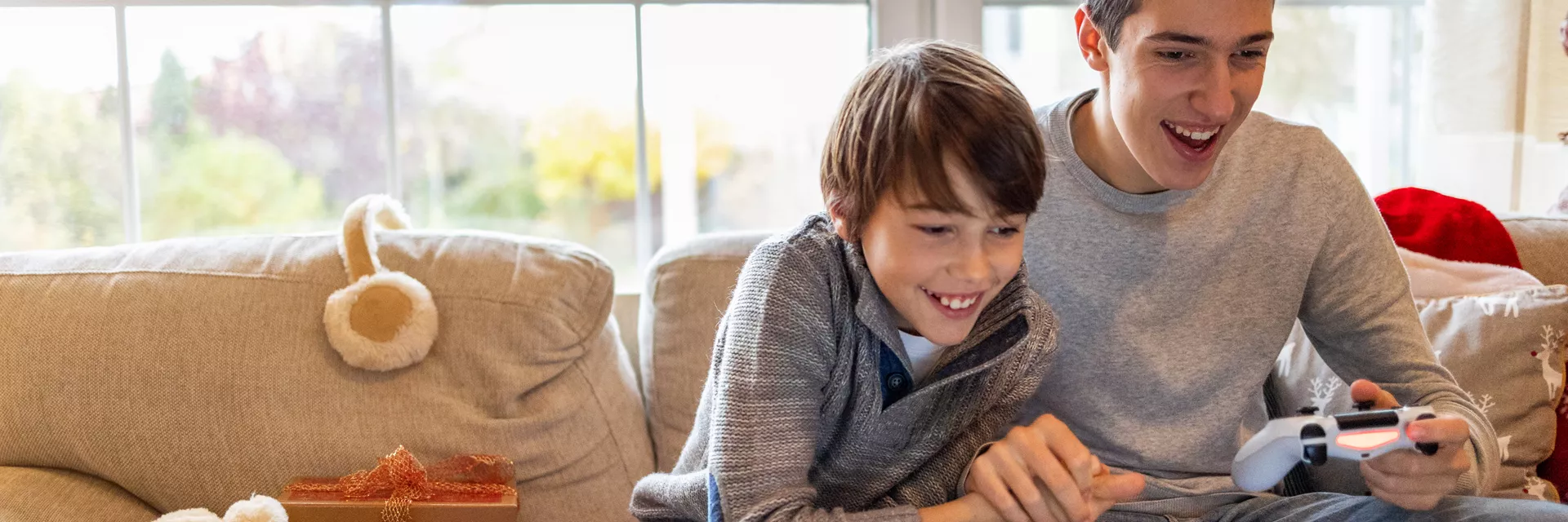 Young person and support worker playing video games