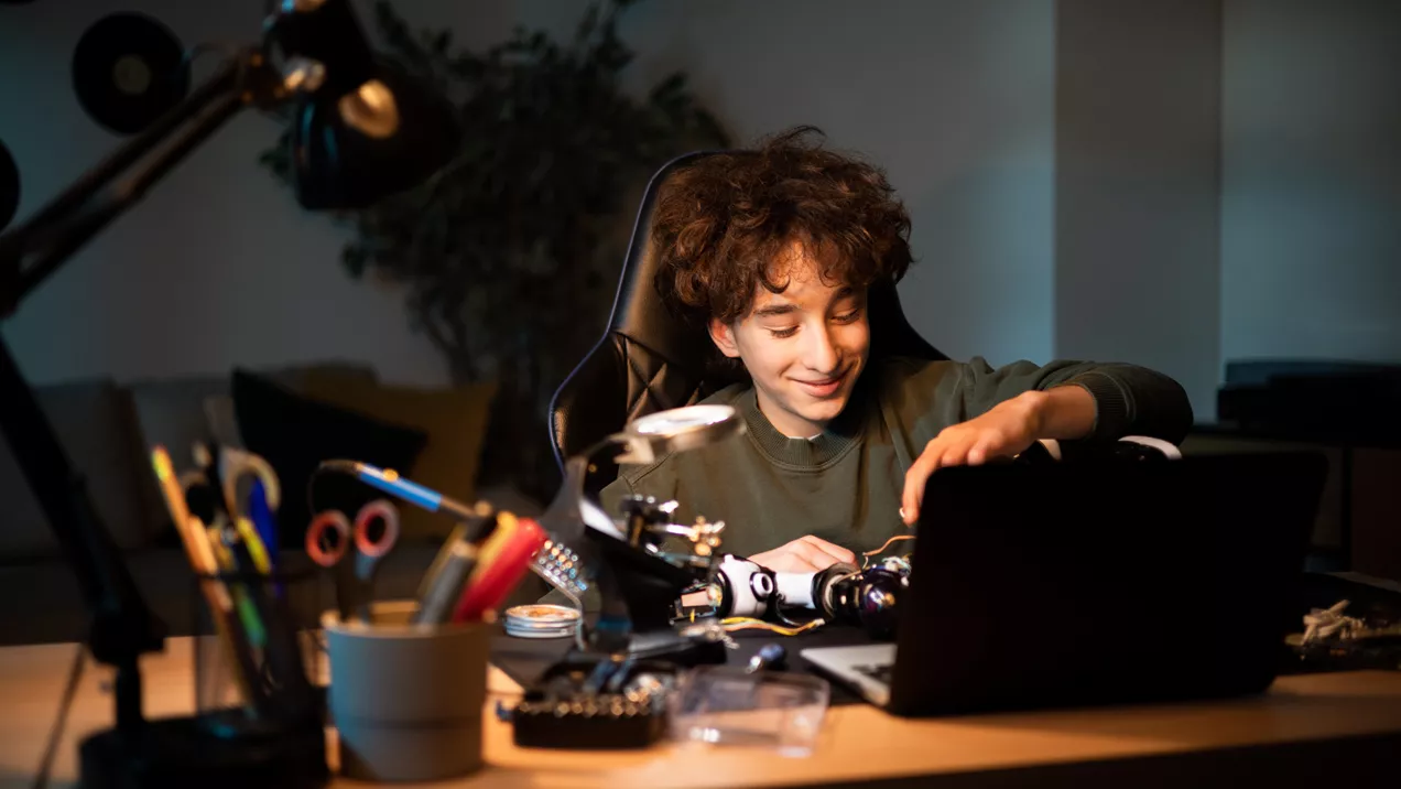 Young person enjoying their hobby fixing machines