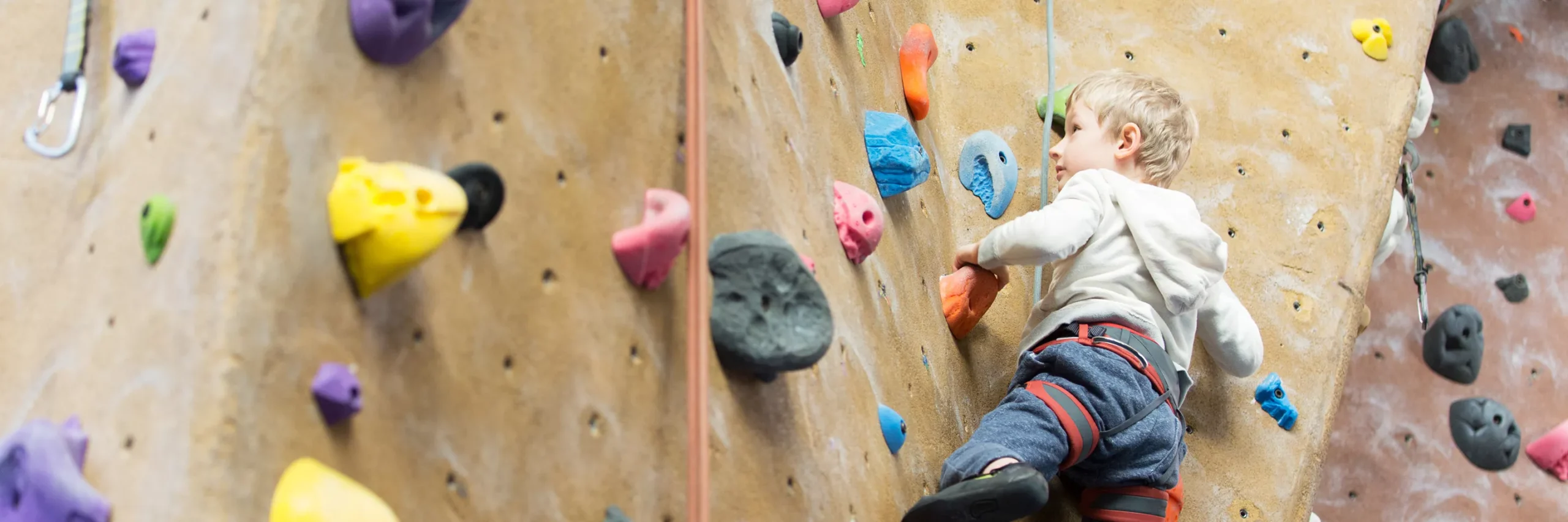 Young person using a climbing wall